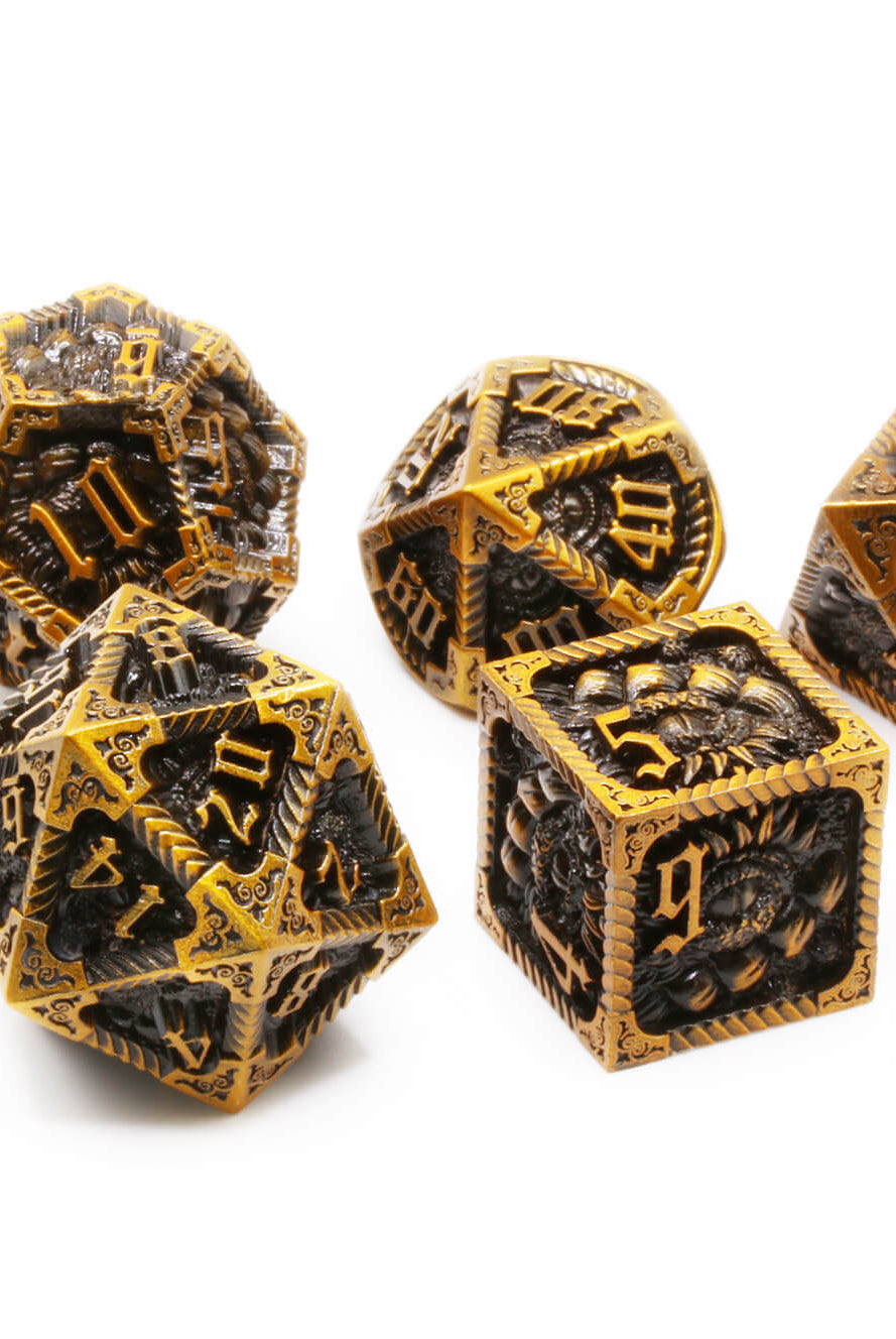 Old gold metal dragon dice at Dark Elf Dice