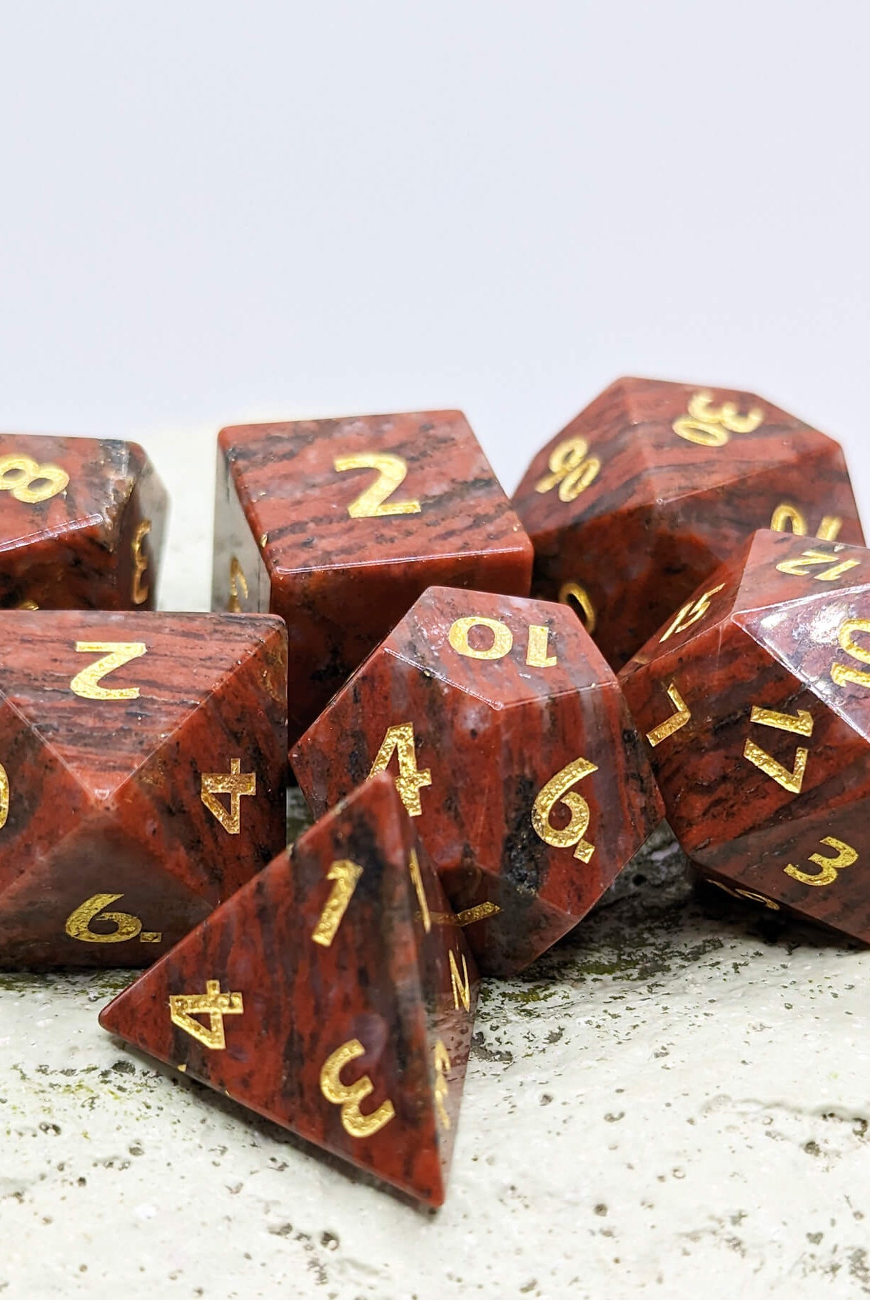 ttrpg dice red granite gemstone