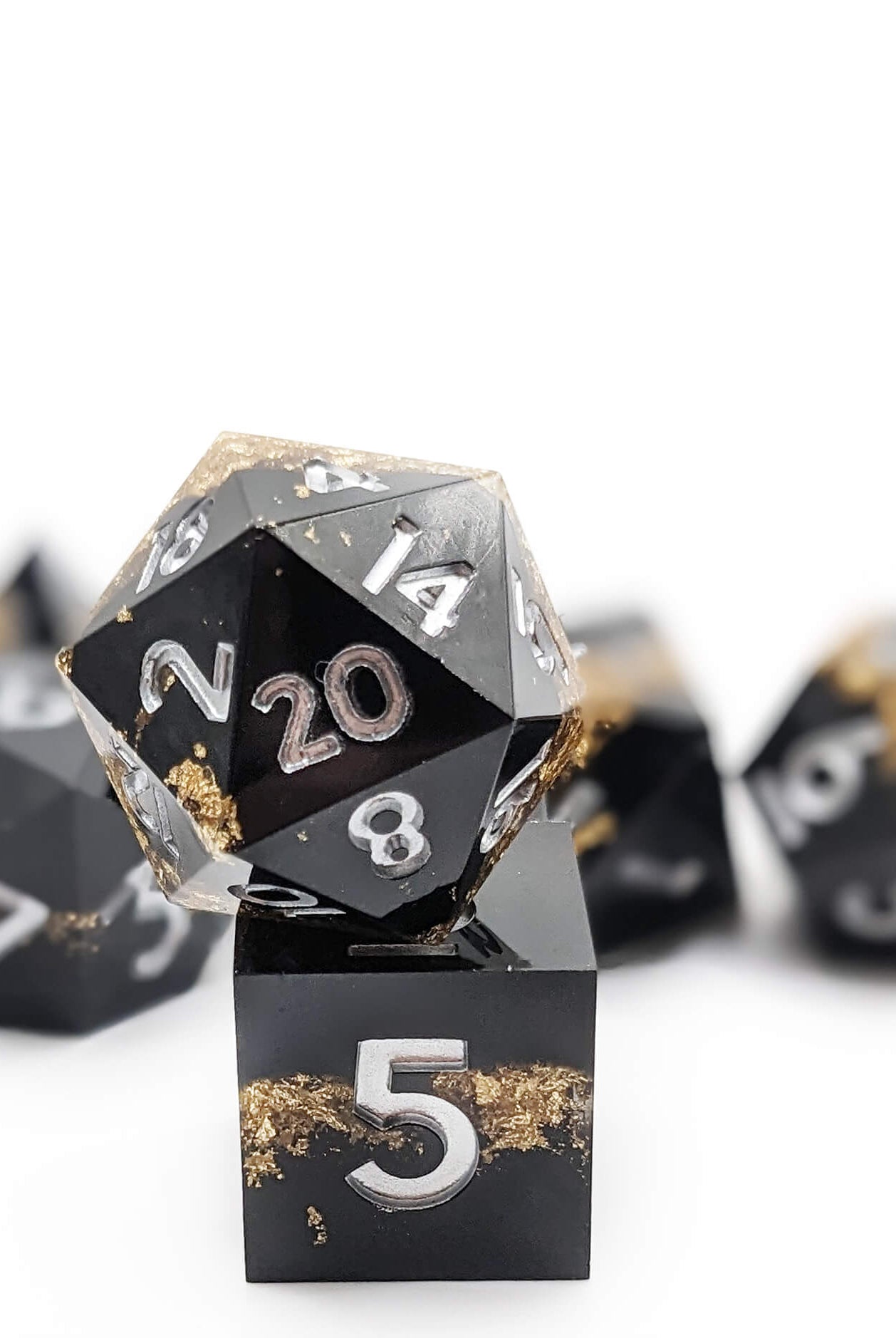 beautiful black and gold d20 from the gold rush dice set