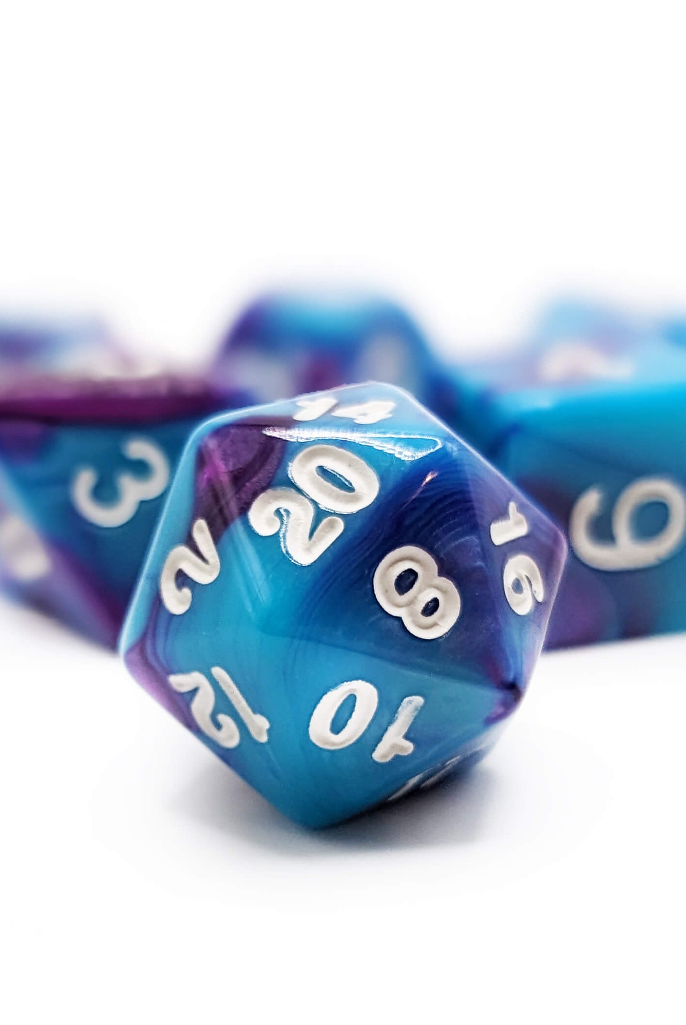 Blue and purple d20 for ttrpg games
