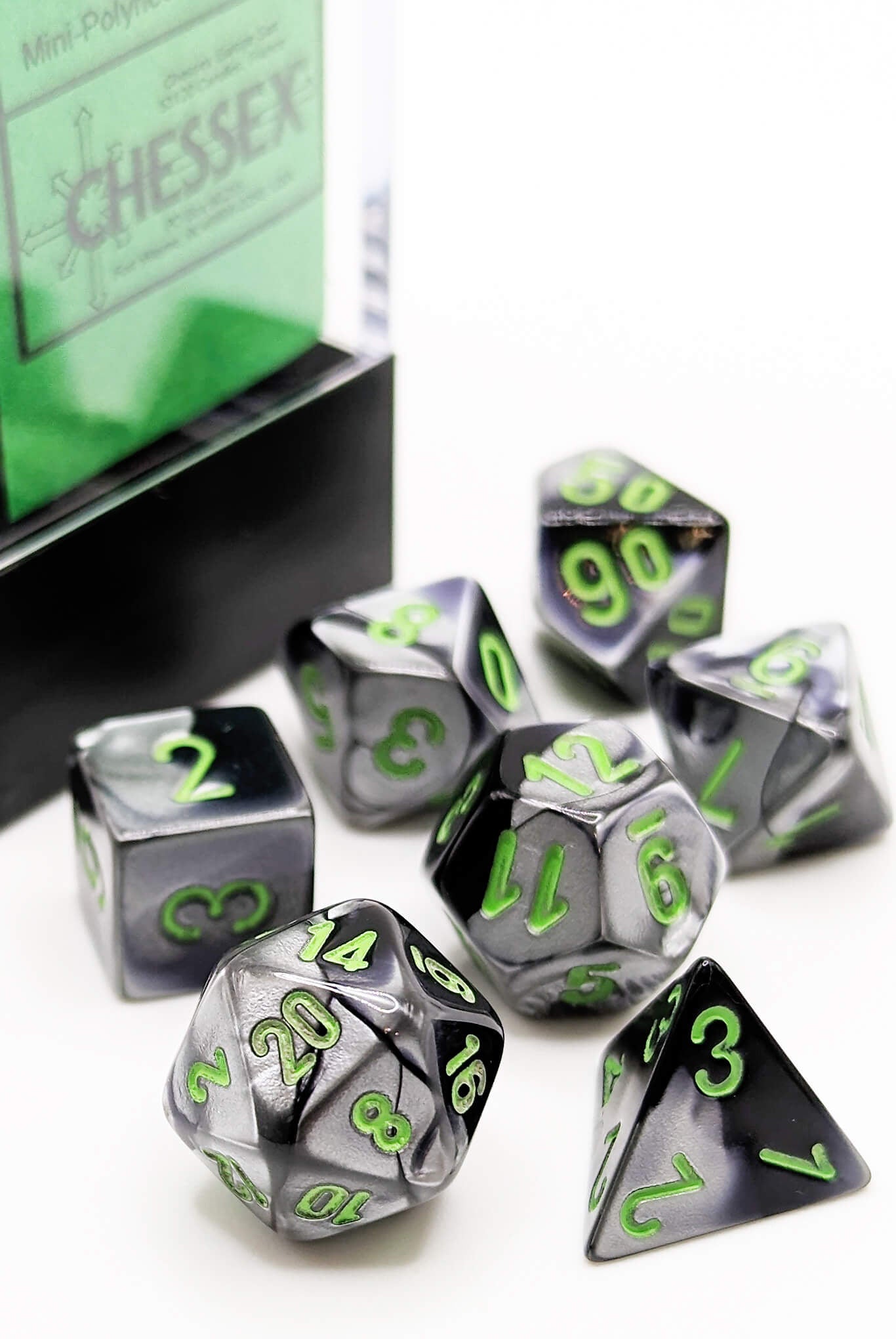 Chessex Black and Grey mini dice with green numbers chx20645