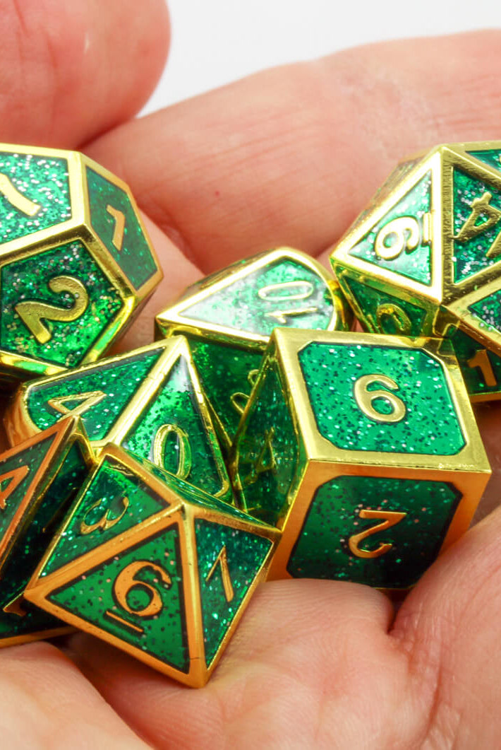 Green and gold enamel dice