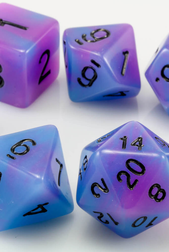 blue and purple glow in the dark dice