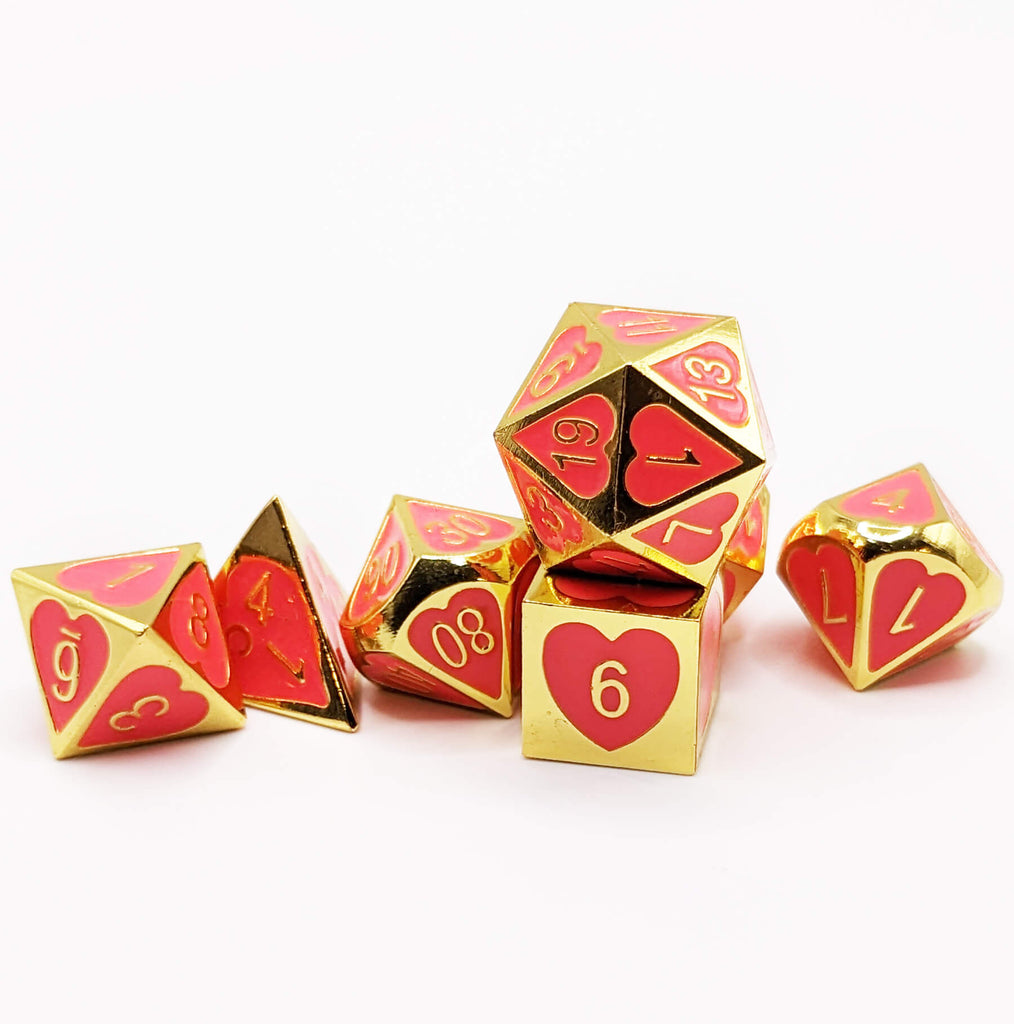 Hot pink and gold metal dice for dnd games