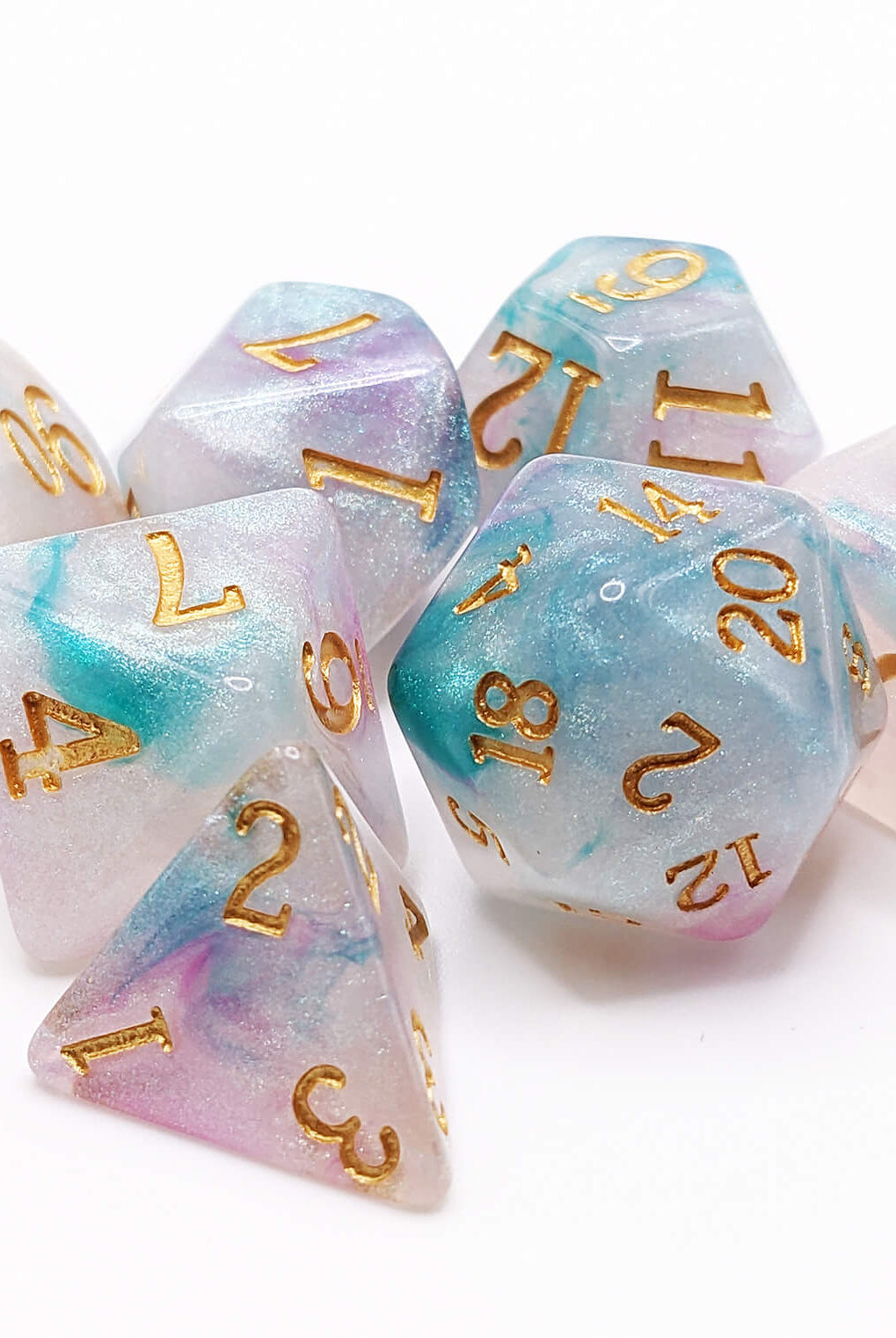 Teal and pink iridescent dice for ttrpg games