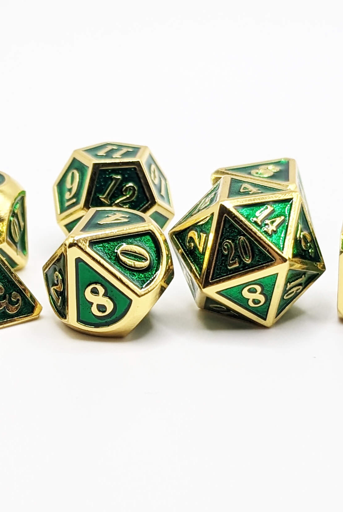 green and gold metal dice set