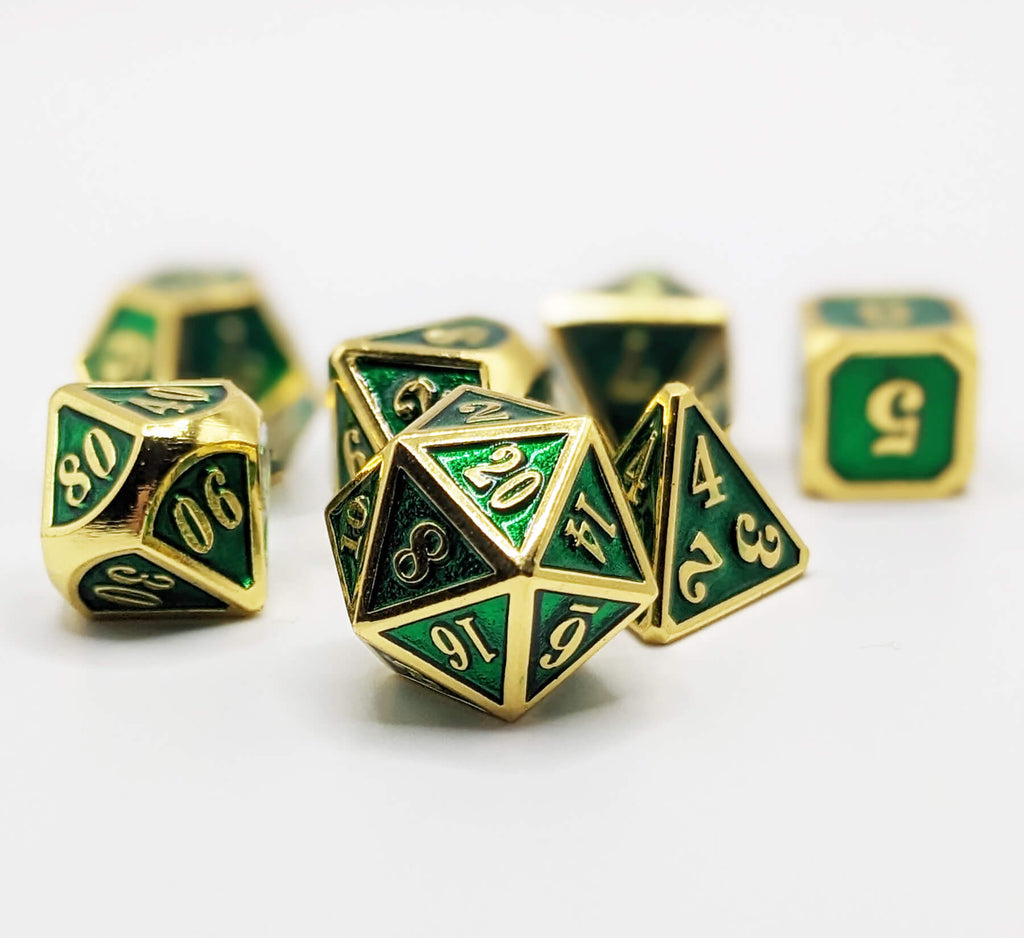 Emerald green and gold metal dice for dnd games