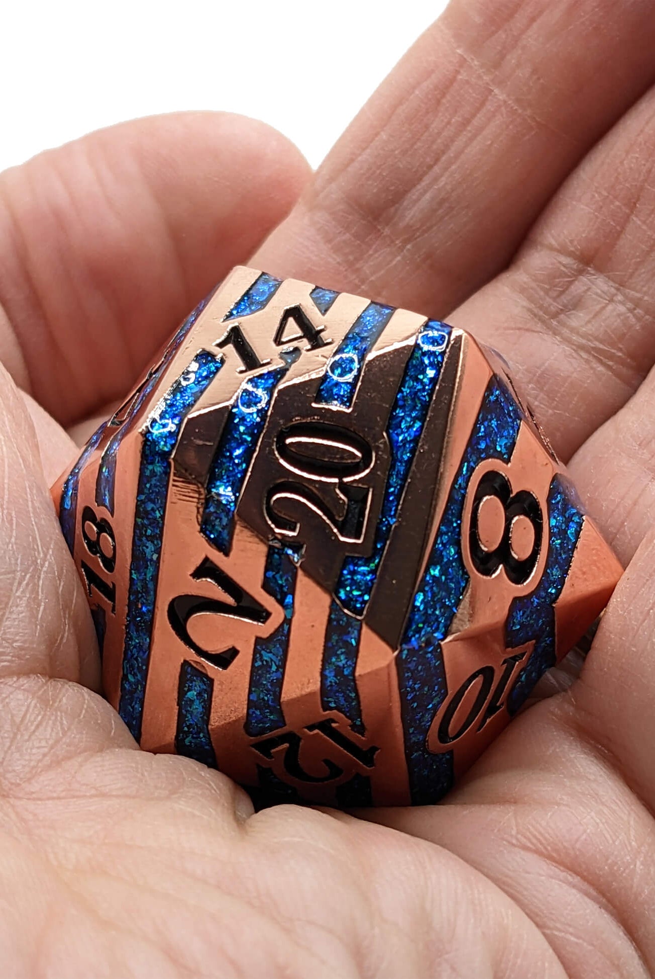 Giant copper and blue d20 dice