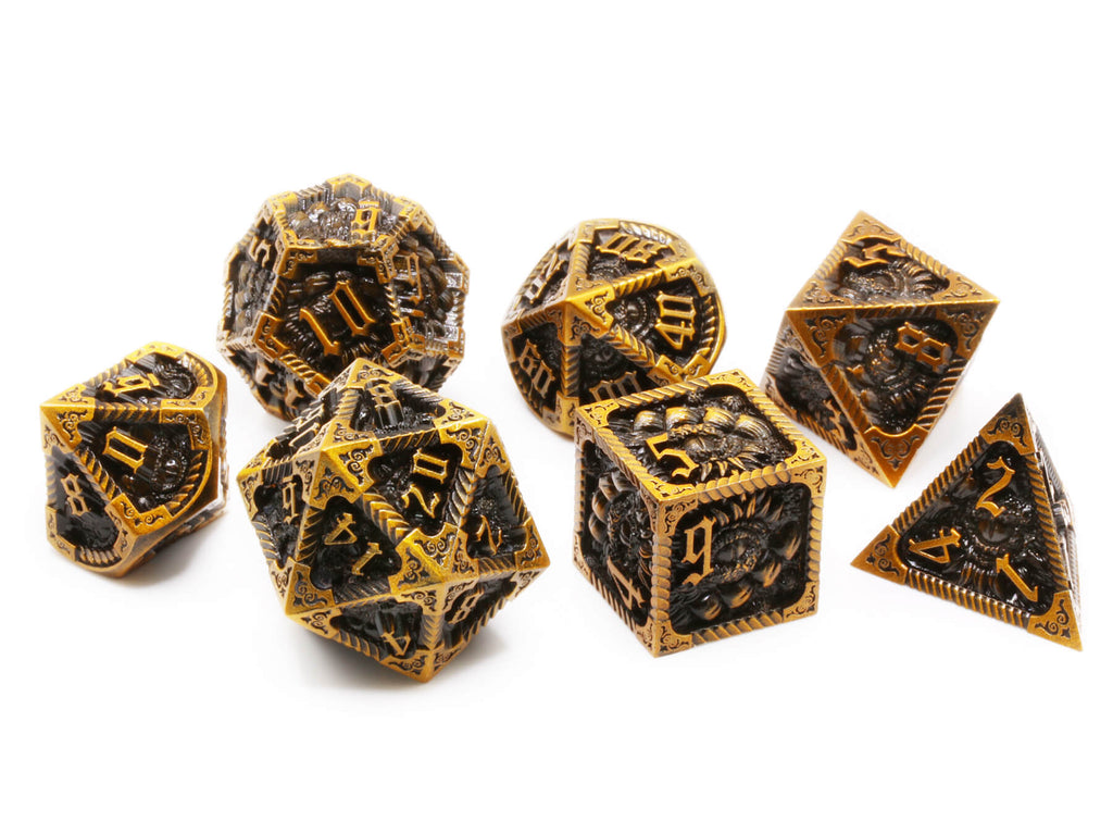 Old gold metal dragon dice at Dark Elf Dice