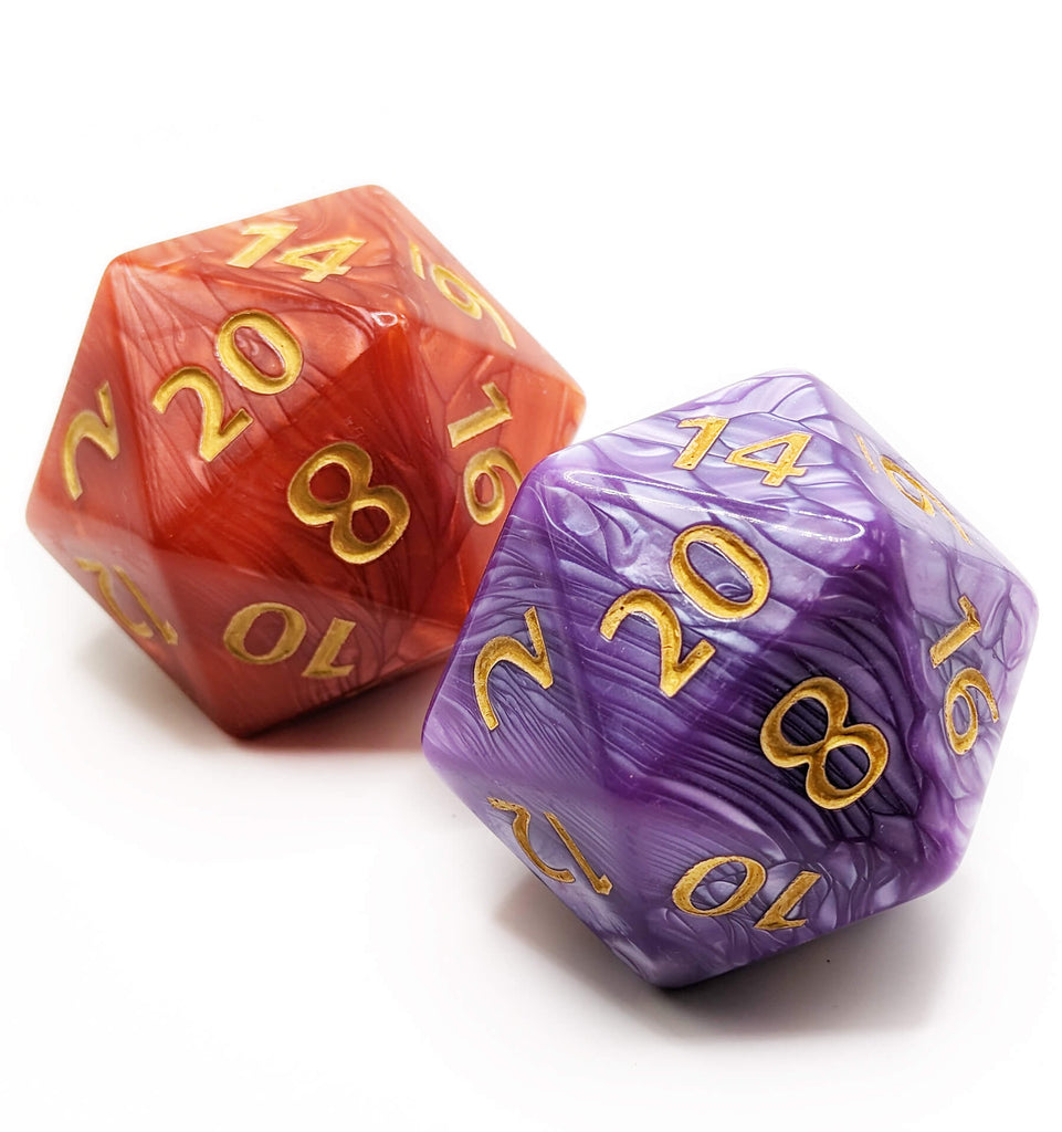 Giant chonky d20s with pearl finish and gold numbers