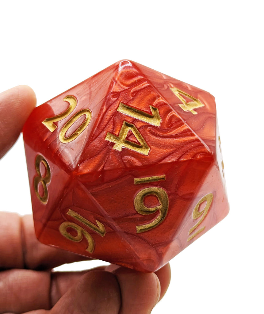 Giant red and gold d20 dice