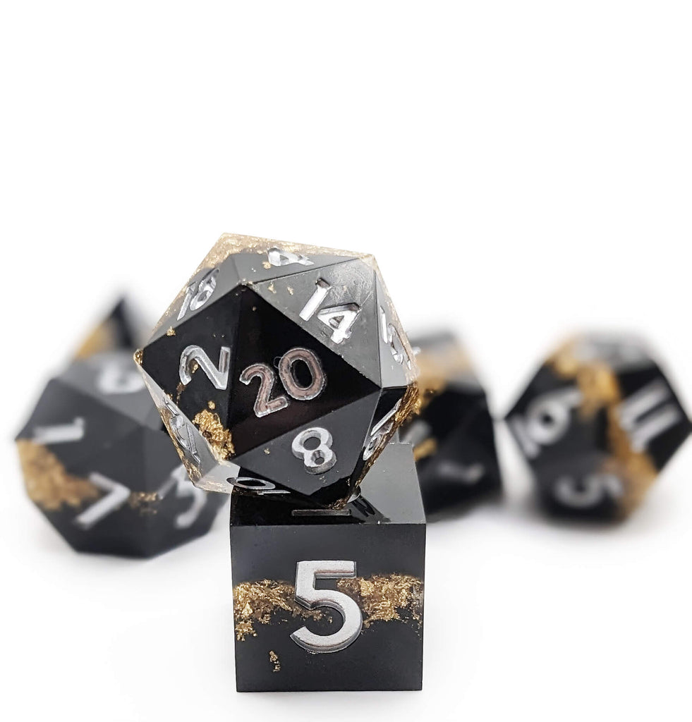beautiful black and gold d20 from the gold rush dice set