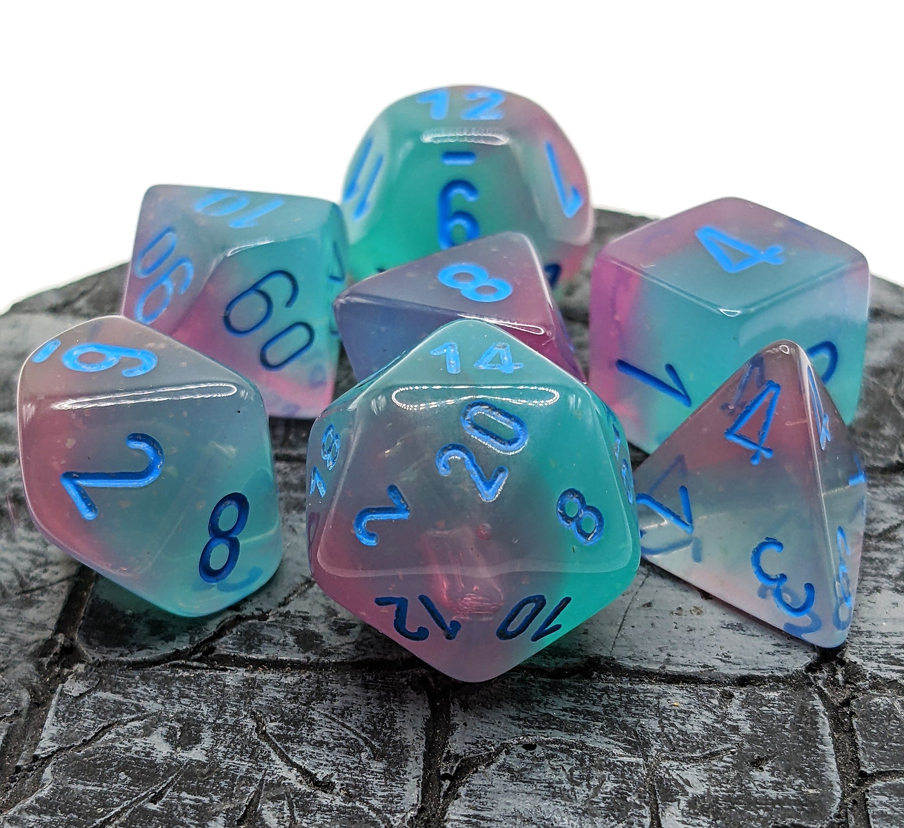 Chessex Gemini Gel Green-Pink dice with glown in the dark luminary effect.