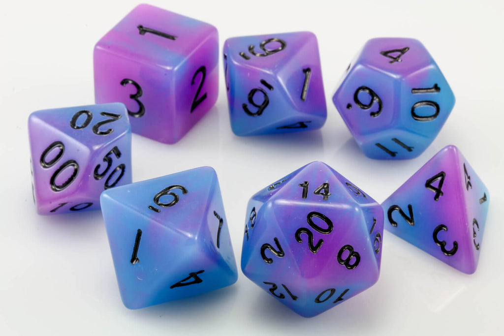 blue and purple glow in the dark dice