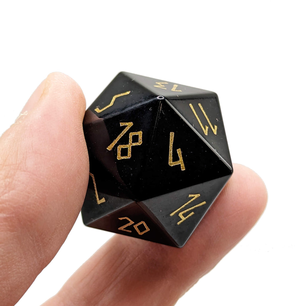 black obsidian gemstone d20 dice with gold numbers 