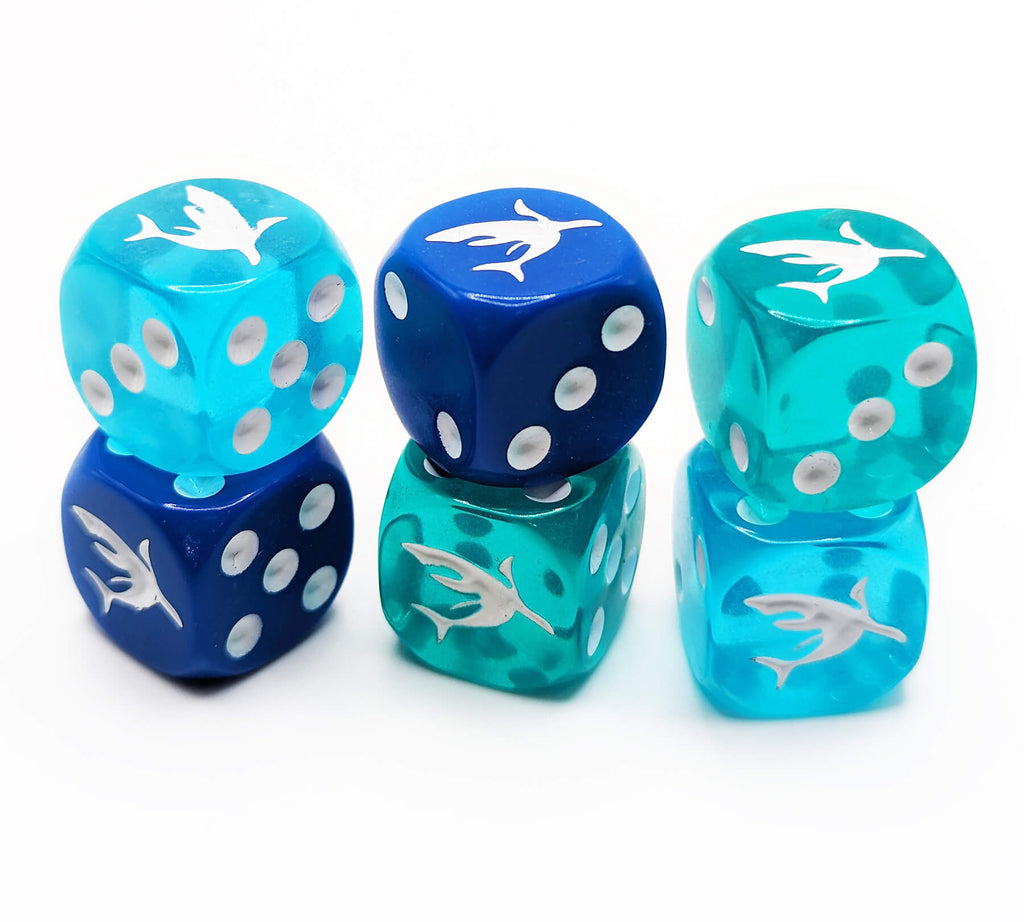 Six-sided dice with sharks