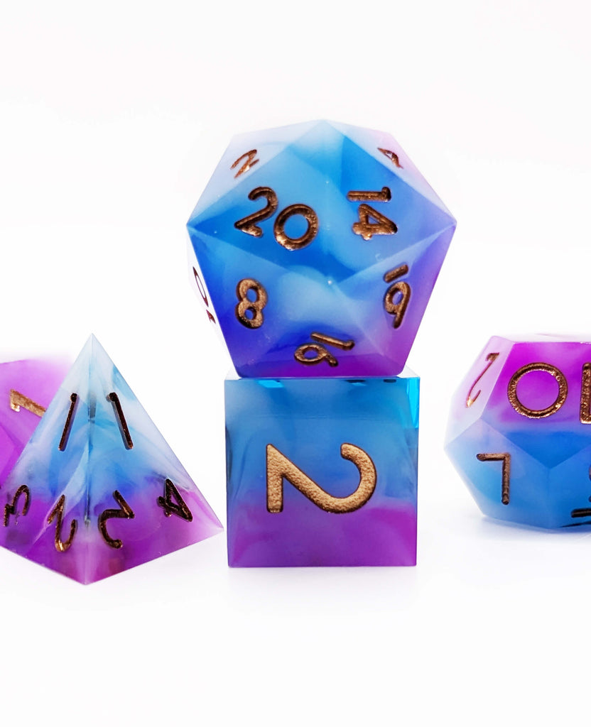 Blue and purple d20 dice
